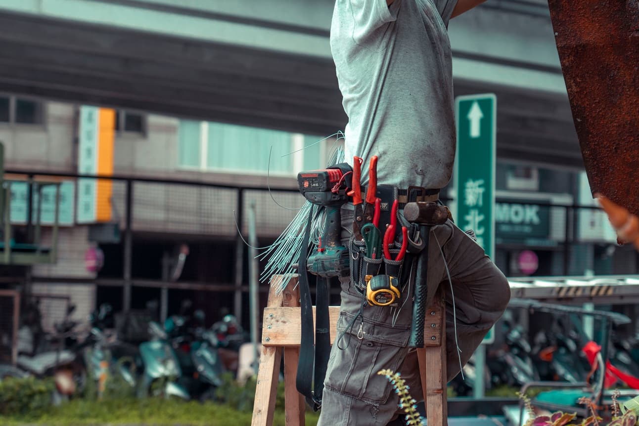 Professional electrician repairing a wiring panel in Port Harcourt